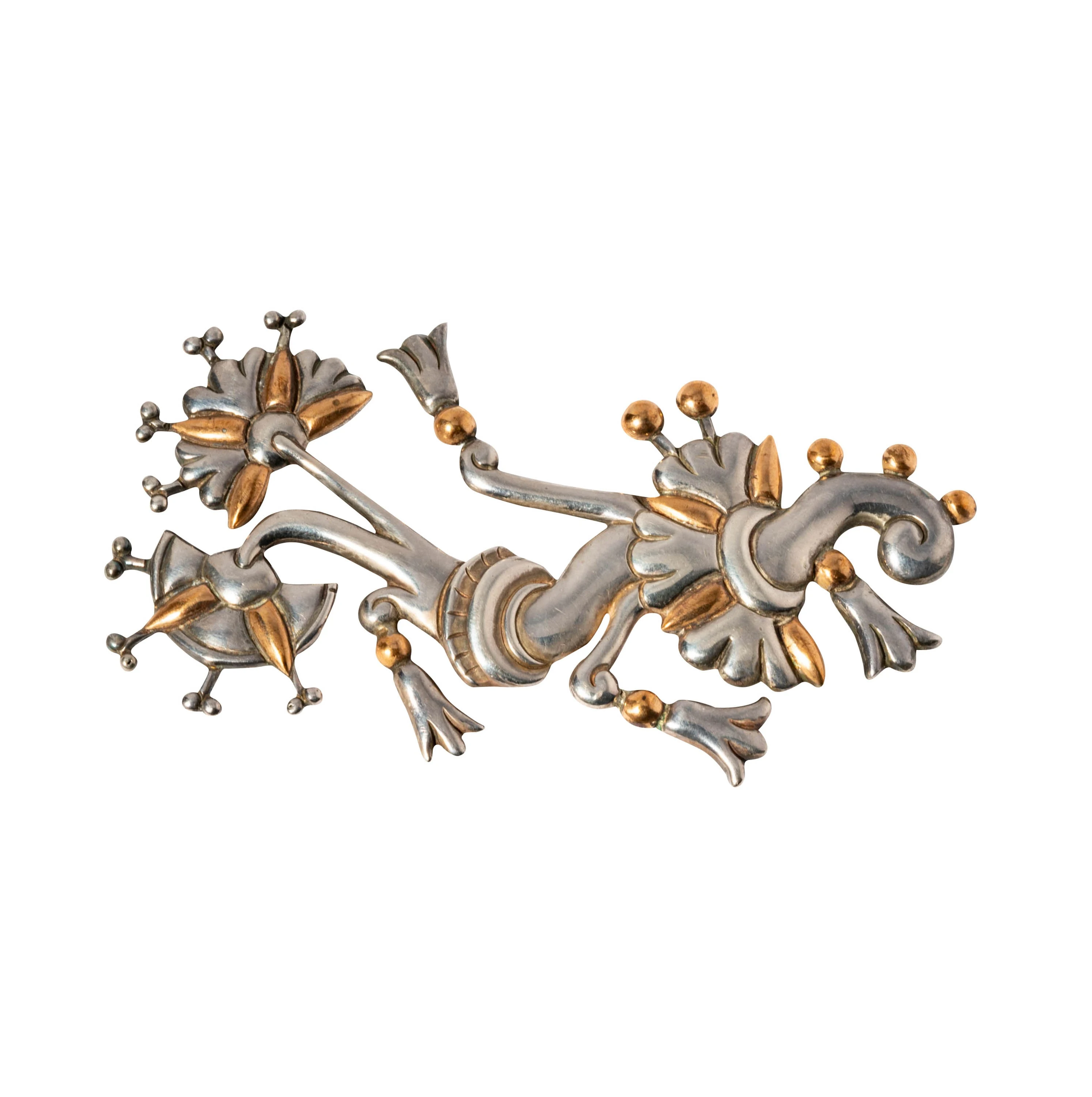 William Spratling's Tree of Life pin in sterling silver, late 1940s. A symmetrical openwork composition of a stylized tree with branches splayed from a central trunk, hand-fabricated from cut and oxidized 980 silver.