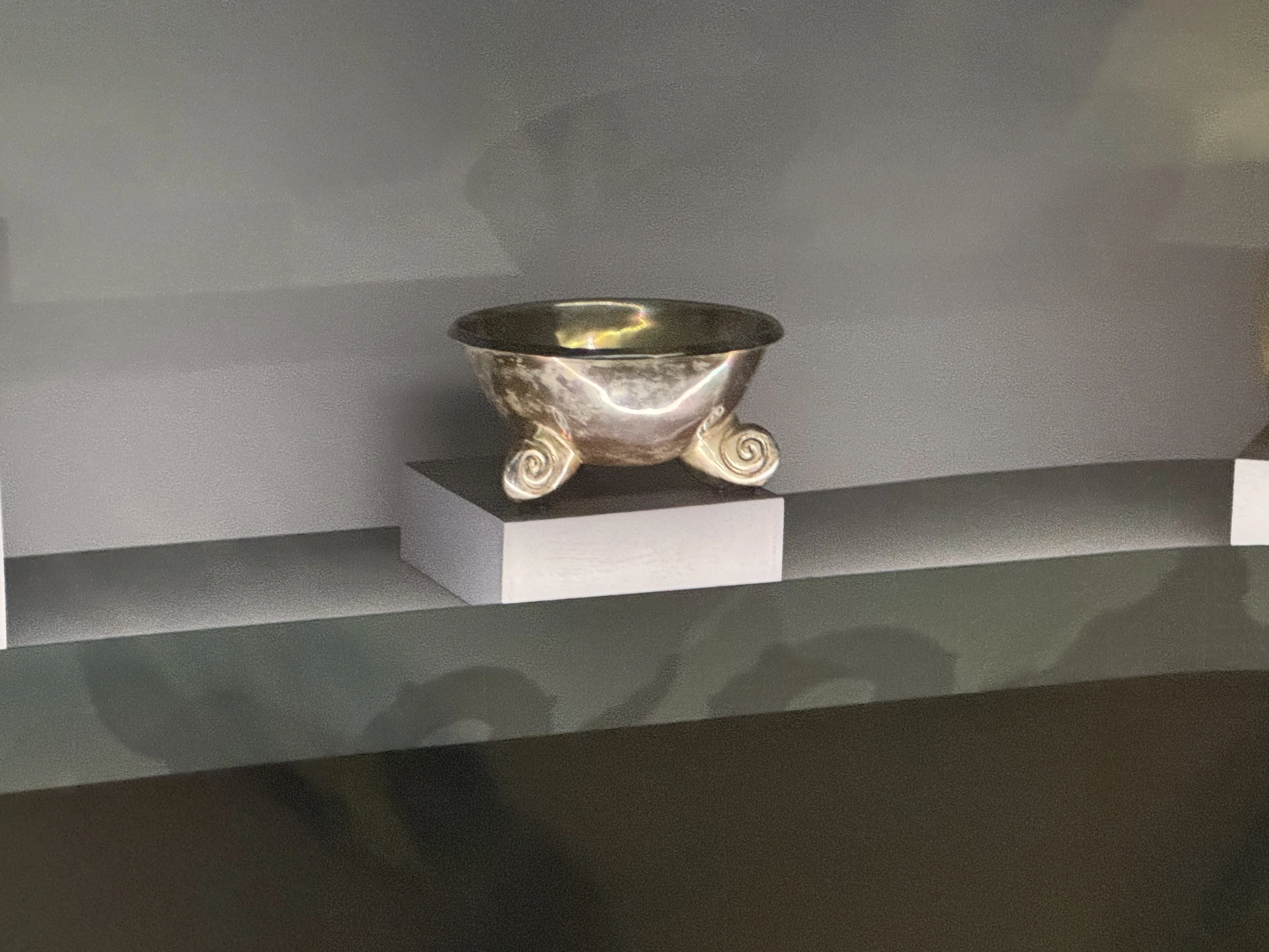 Tripod bowl with scroll feet
