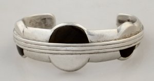 Cuff Bracelet with Three Round Discs Divided with One Half - Photo 1