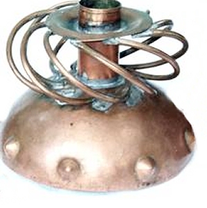 Round Copper Candlestick with Swirled Diagonal Wires Above - Photo 1