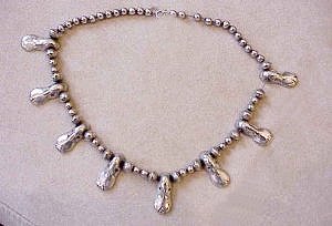 Eight Silver Duck Heads Are Separated by Small Silver Round - Photo 1