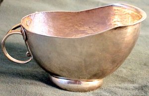 Oval Creamer of Hammered Silver Sits on a Domed Base - Photo 1